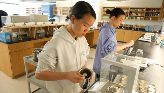 Mira and Michi Dihn working in the Hartwick College Center for Craft Food & Beverage