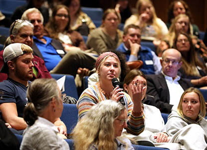 Hartwick College student asking question during forum discussion