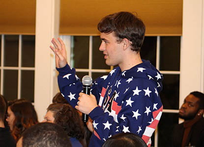 Hartwick student asking a question during a lecture on campus