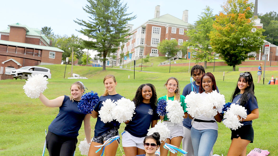 Hartwick College cheerleaders welcoming new students to campus during Wick Week
