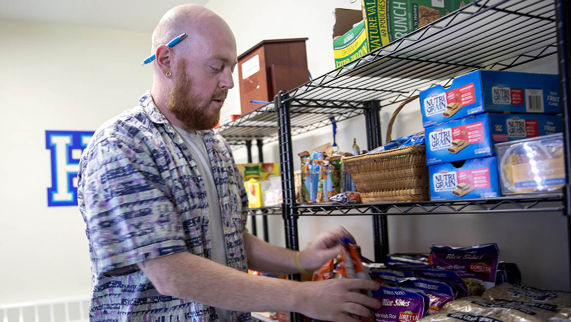 Hartwick College Alex Douglas, Civic Engagement Coordinator working the the food pantry