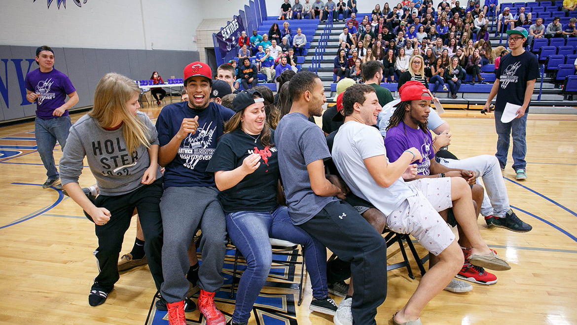 Hartwick College students during musical chairs contest at Hawks' Night Fever in Lambros Arena