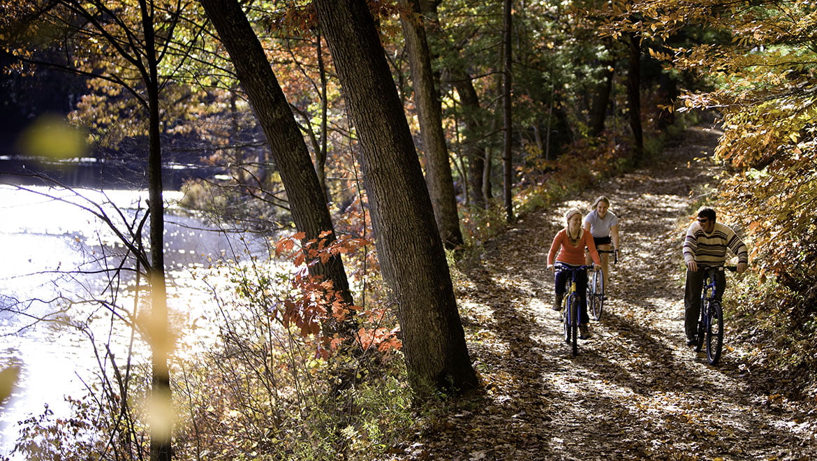 Hartwick College students biking at Pine Lake Environmental Campus