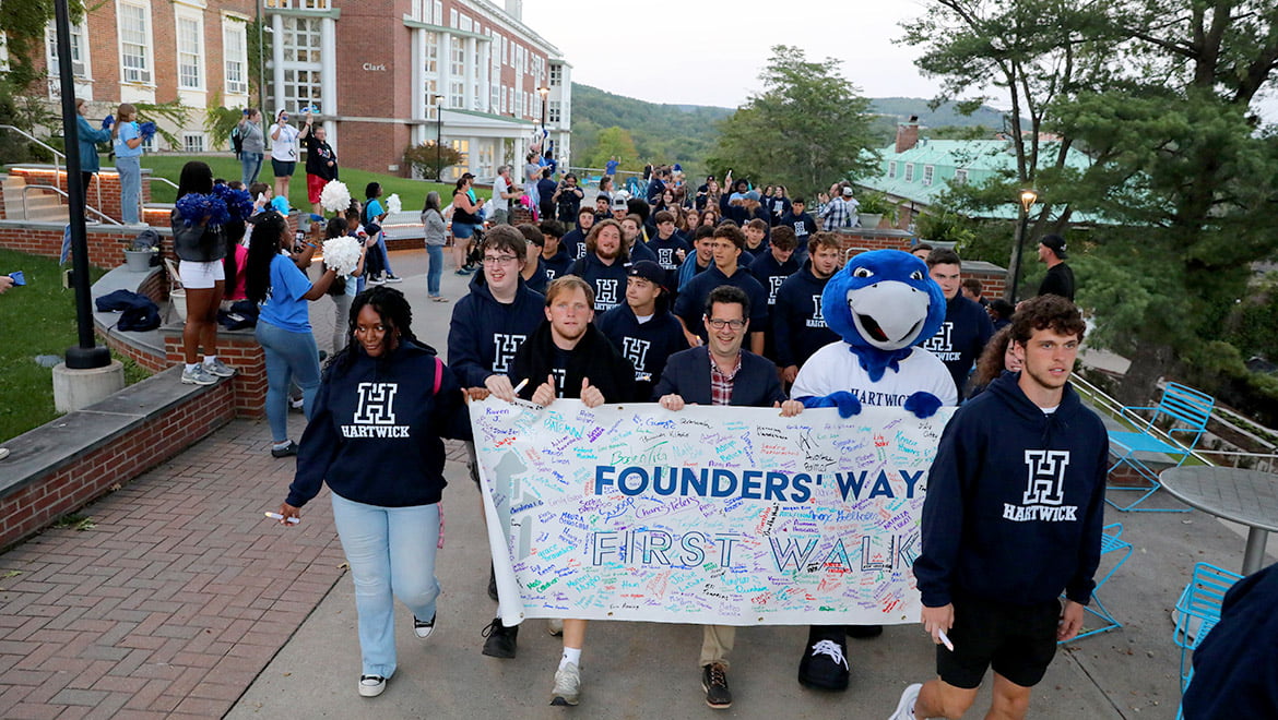 Hartwick College new students with President Darren Reisberg during Class of 2027 First Walk on Founders' Way