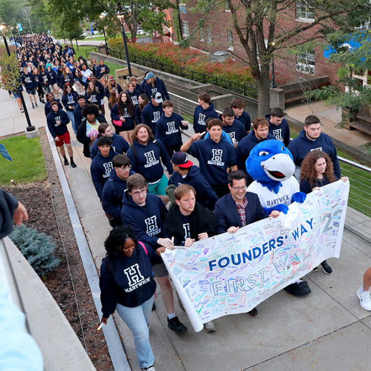 Hartwick College new students with President Darren Reisberg during Class of 2027 First Walk on Founders' Way