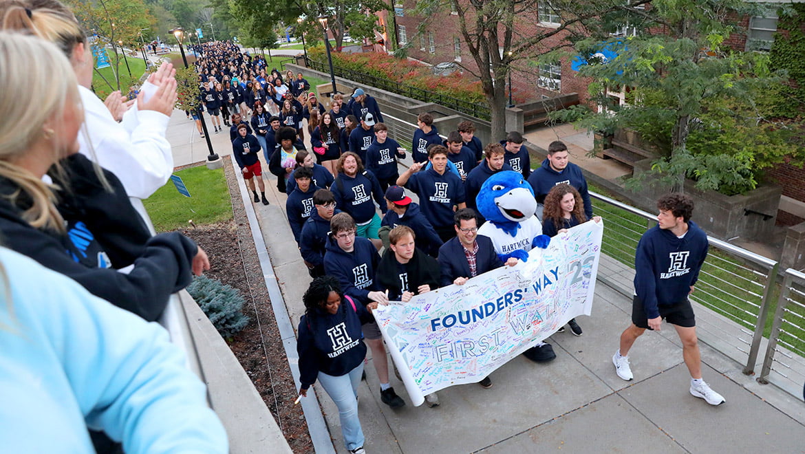 Hartwick College new students with President Darren Reisberg during Class of 2027 First Walk on Founders' Way