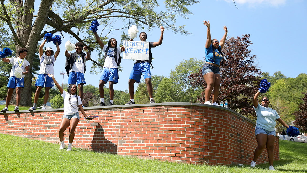 Hartwick College students cheer as they welcome new students to campus on the first day of Wick Week
