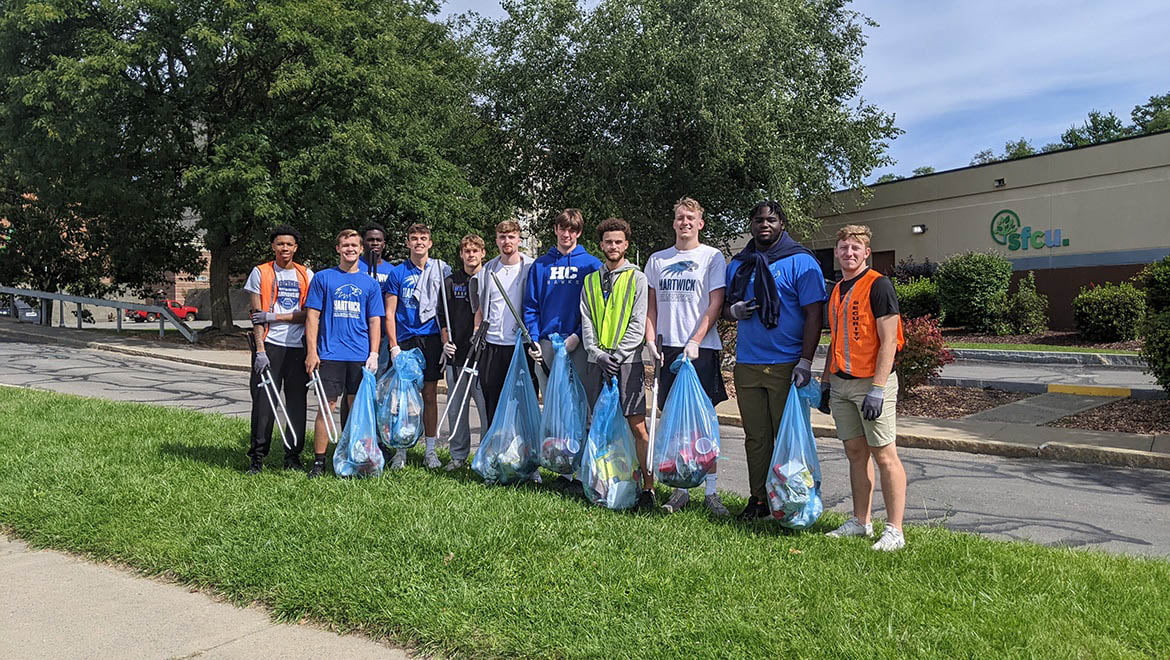 Hartwick College basketball team players during Oneonta city clean-up project