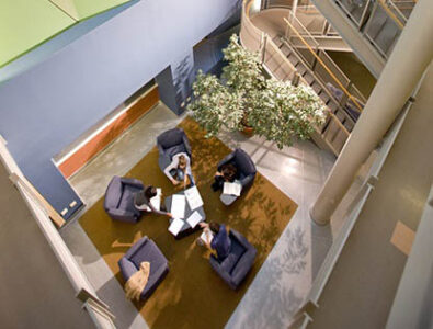 Hartwick College students sitting in Johnstone Science Center lobby
