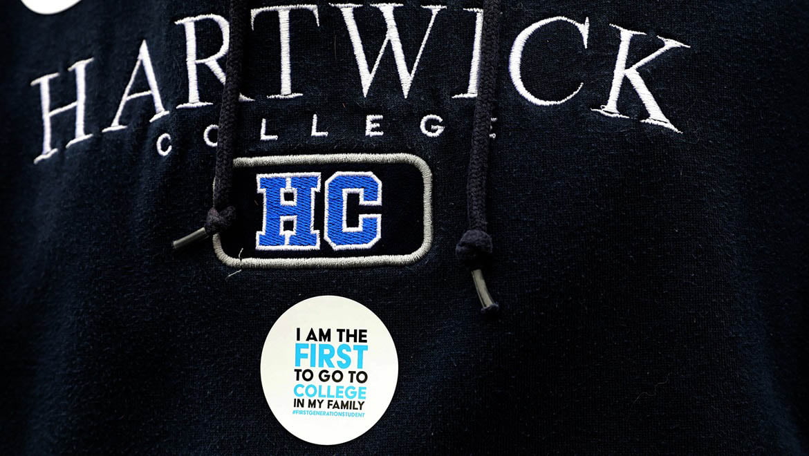Hartwick College sweater shirt with sticker worn by a First Generation College Student during Hartwick College's True Blue Weekend.