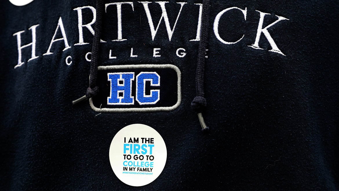 Hartwick College sweater shirt with sticker worn by a First Generation College Student during Hartwick College's True Blue Weekend.