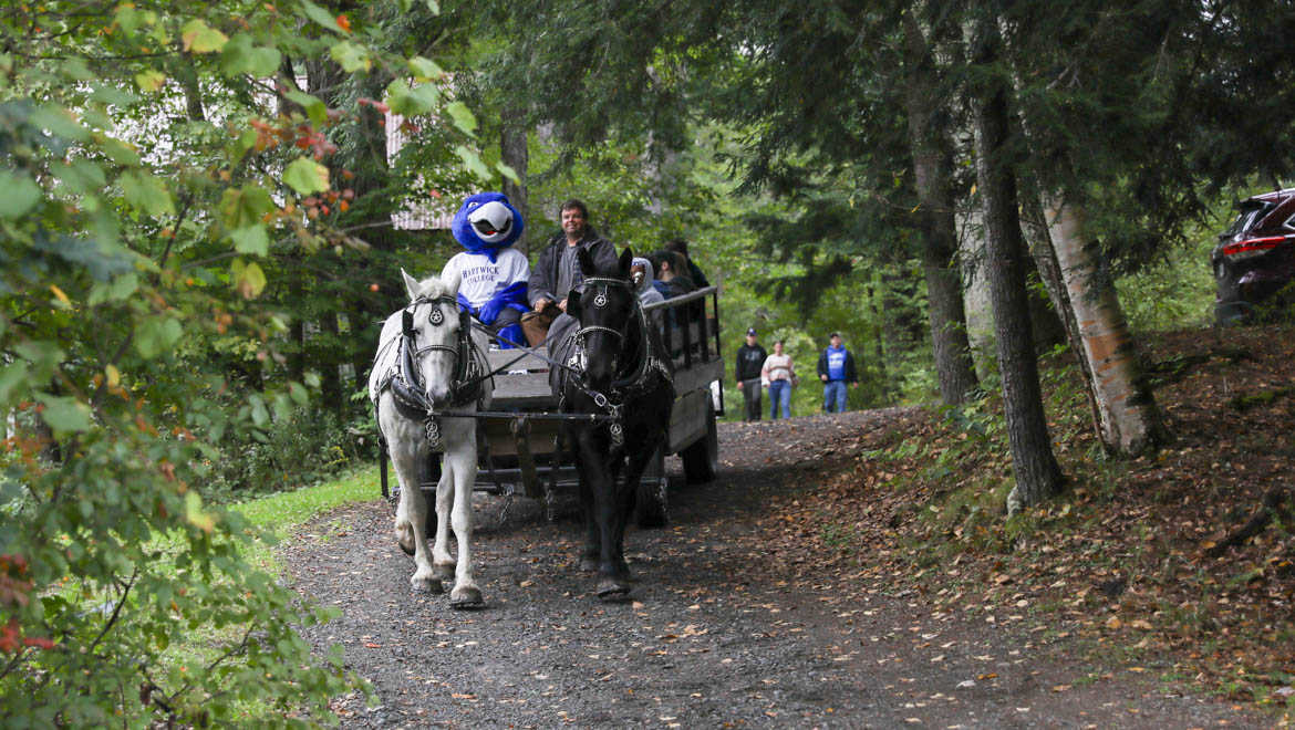 Hartwick College wagon rides at Pine Lake Environmental Campus during True Blue Weekend