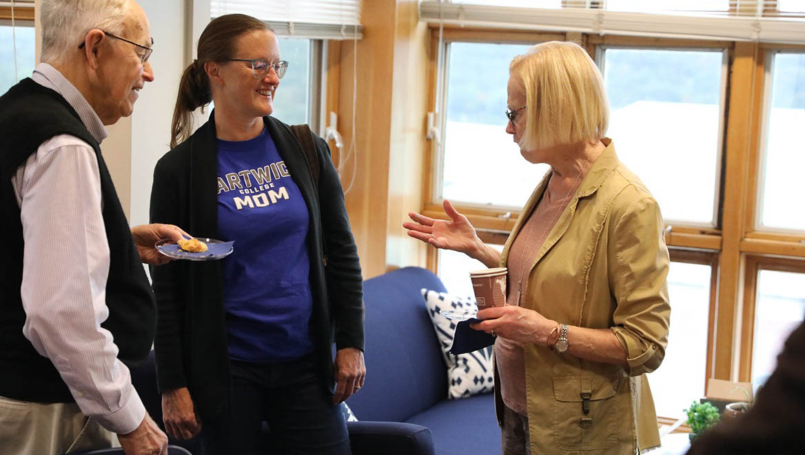 Hartwick College faculty, alumni, students and families gather in the Writing Center during True Blue Weekend