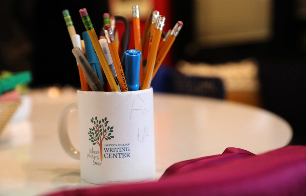 mug of pencils and pens on table
