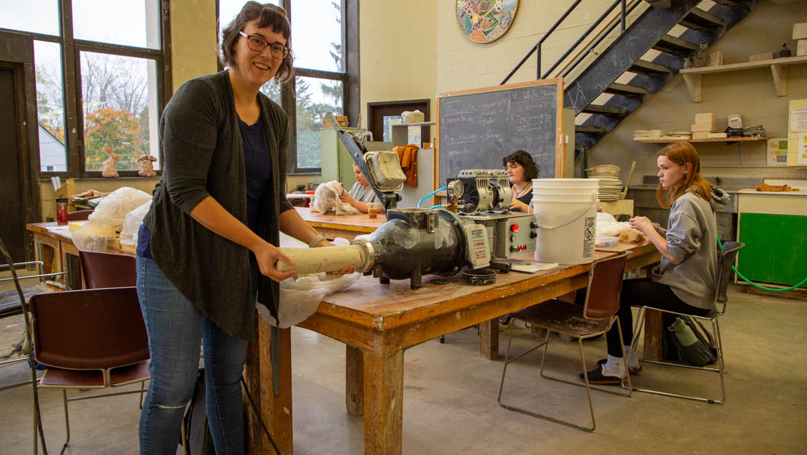 Hartwick College Professor of Art and Art History Stephanie Rozene with recycled clay from pugmill