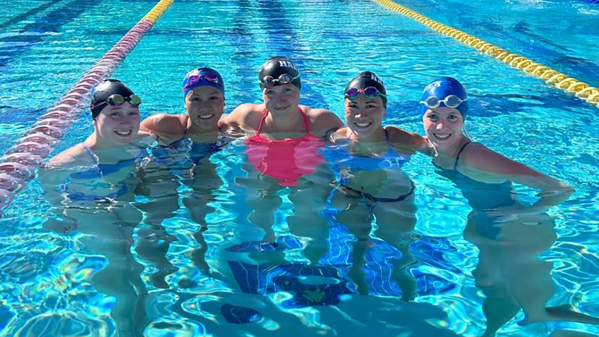 Amanda Wilbur with other swimmers in pool