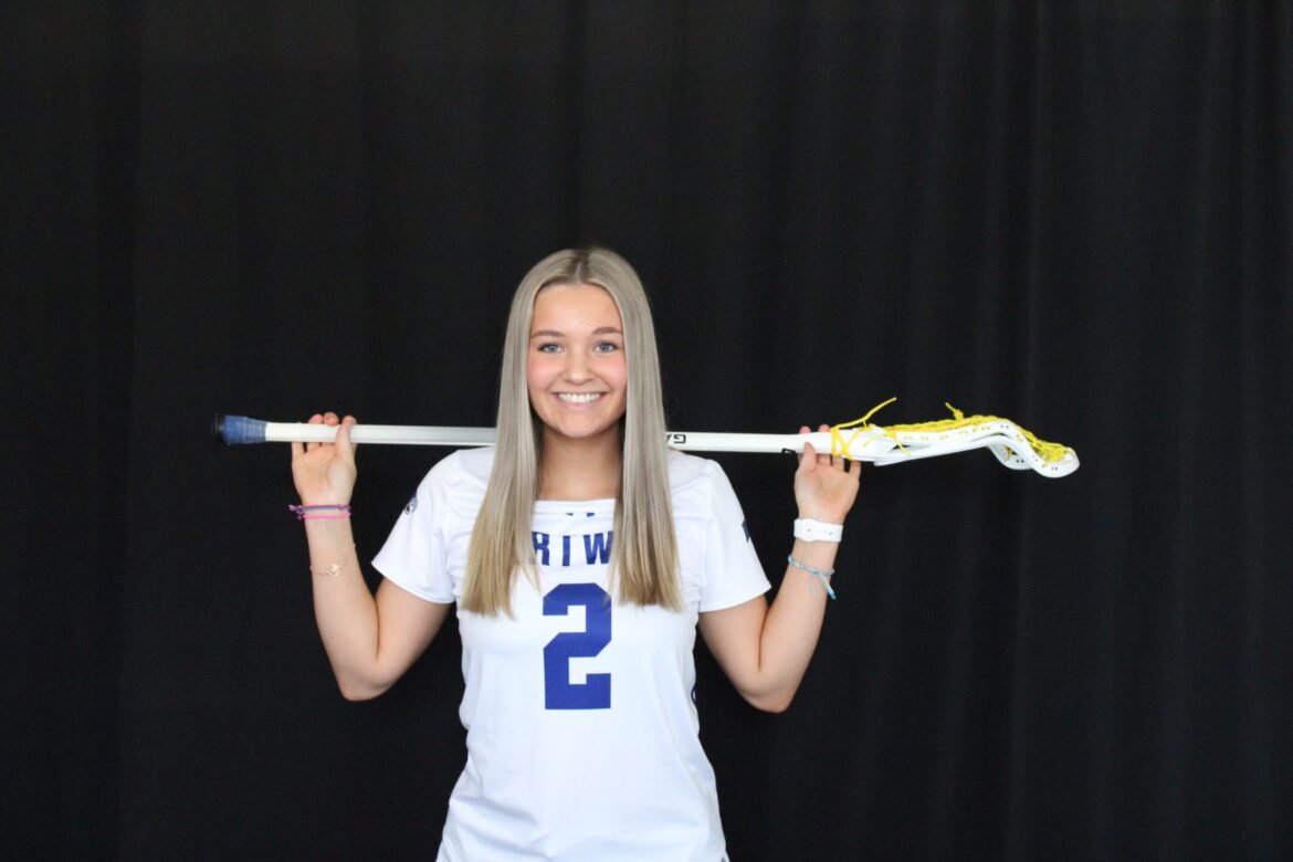 Posed portrait of Brianna with Lacrosse stick