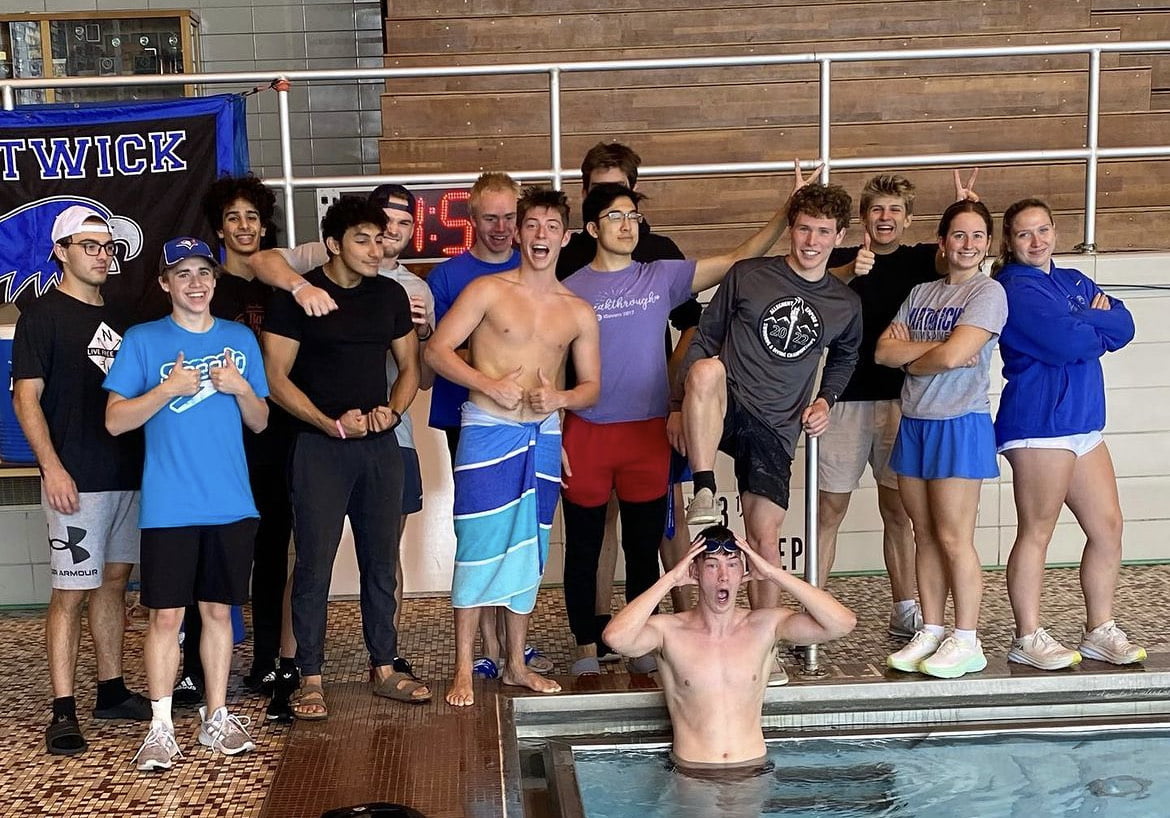 students pose in swim pool at Hartwick College