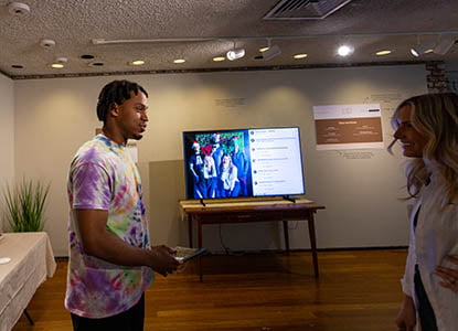 Hartwick College students during Student Showcase exhibition of capstone work