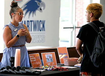 Hartwick College student talking with representative during Health Professions Industry Days event