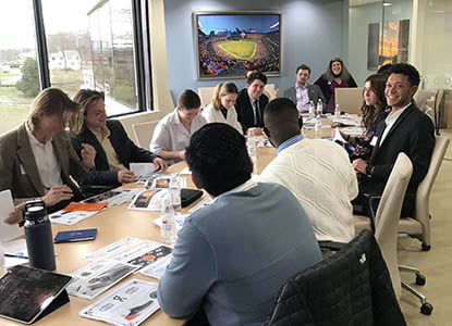 Hartwick College students in board room