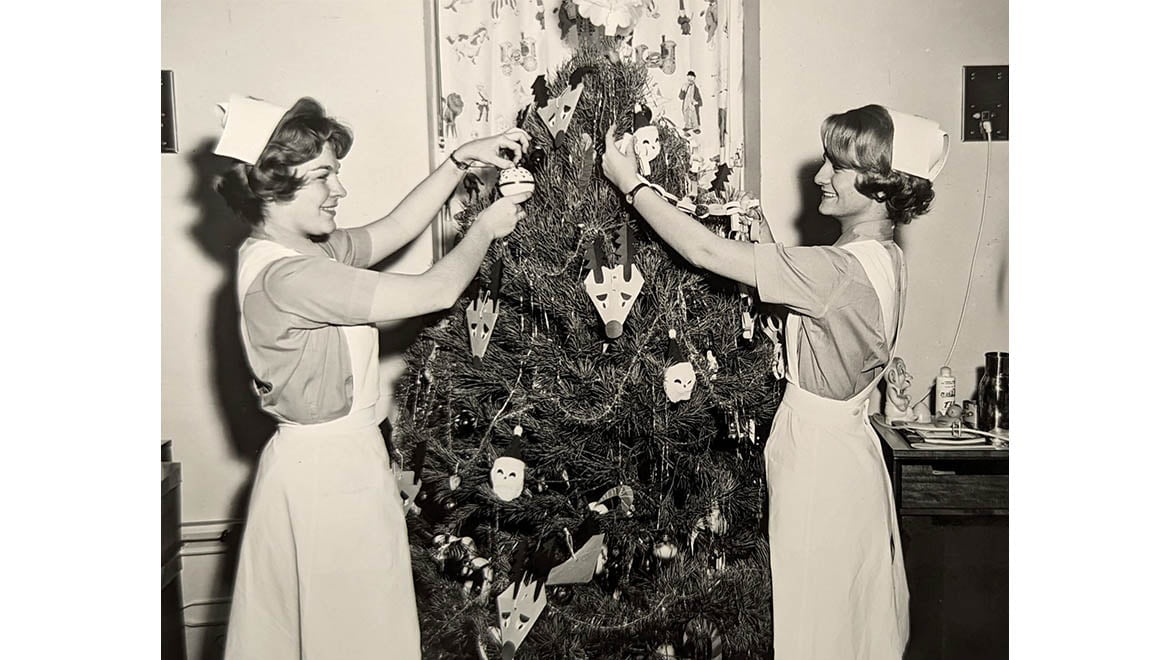 Hartwick College Nursing students decorating Christmas Tree, 1960