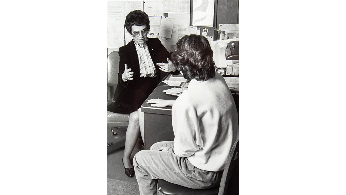 Hartwick College nursing professor Perrie Saxton, 1983, talking with a student