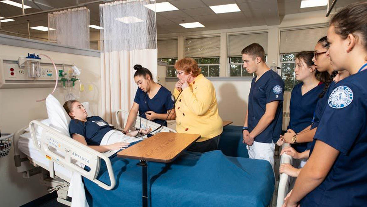 Hartwick College Nursing students in Sim Lab with faculty