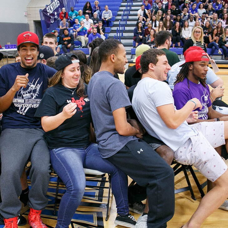 Hartwick students having fun at Hawks Night Fever event in Lambros Arena