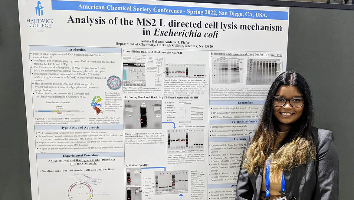 Hartwick College student with research poster at National Chemistry Conference