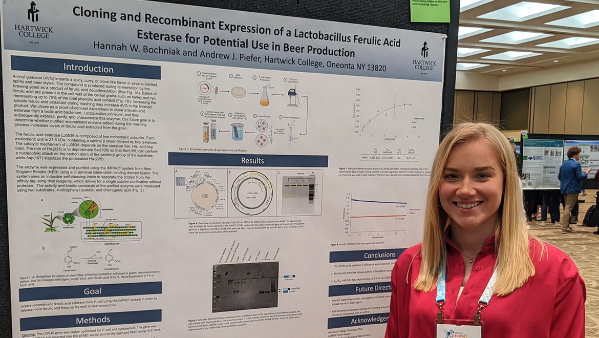 Hartwick College student with research poster at National Chemistry Conference