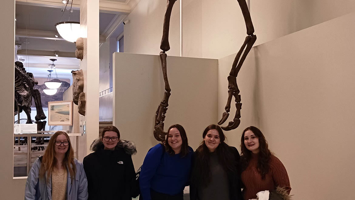 Hartwick students in Museum of Natural History during filed trip for J Term Course Monsters and Musicals
