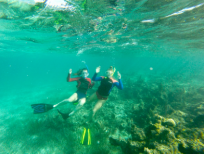 Hartwick College students snorkeling on coral reef