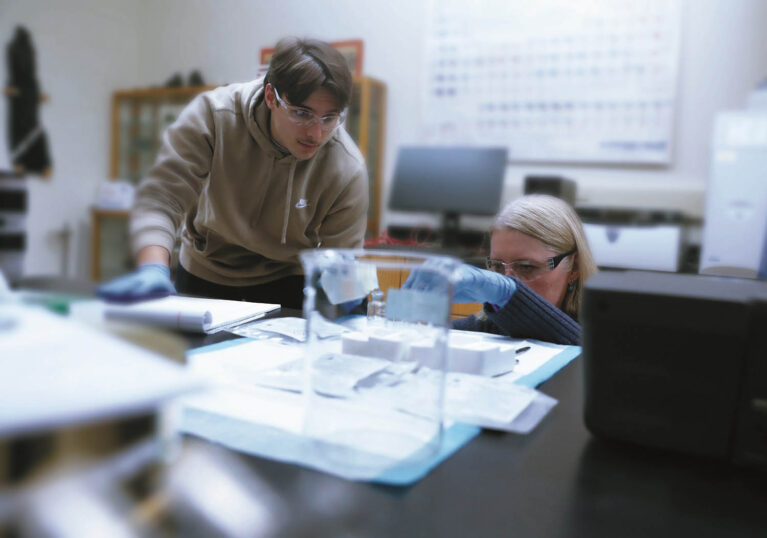 Hartwick College student working in environmental chemistry lab with faculty member