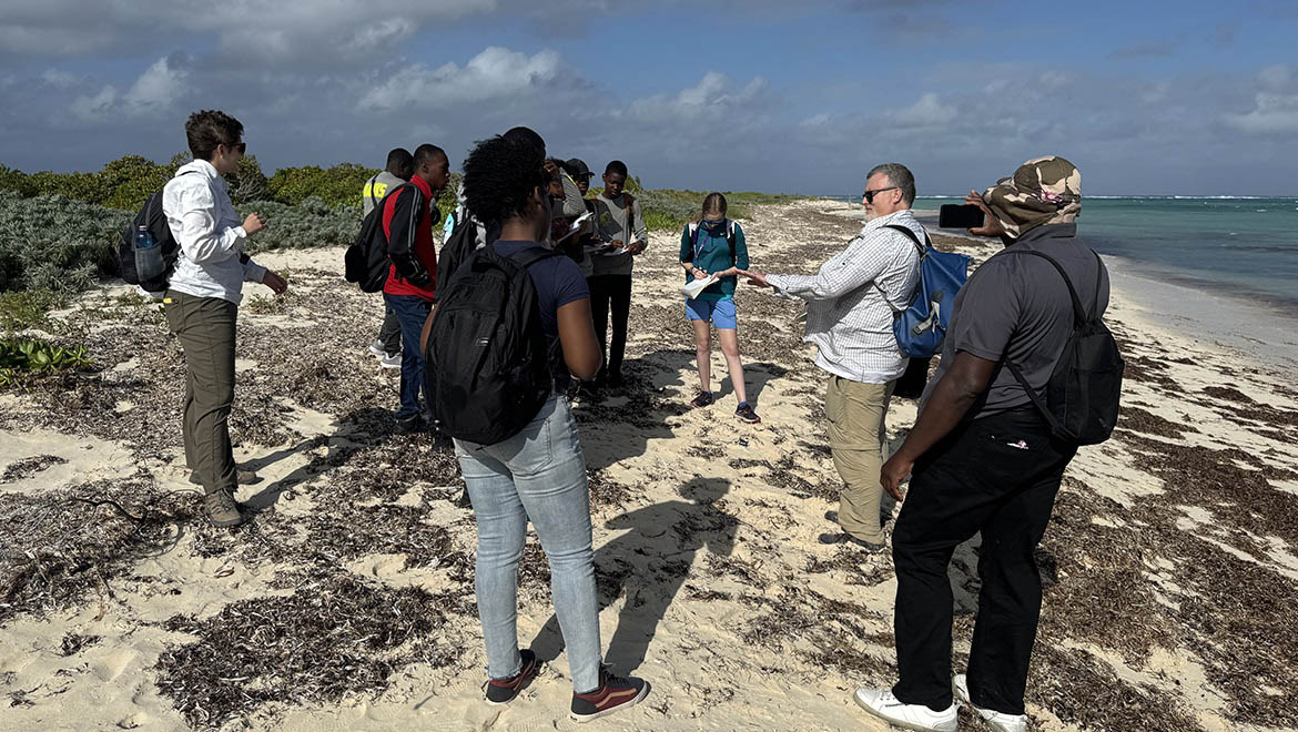 Professor Griffing and Alyssa Shaeffer with school group for Coral Outreach