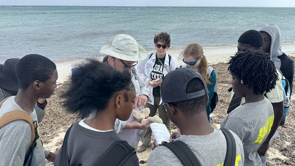 Professor Griffing and Alyssa Shaeffer with school group for Coral Outreach