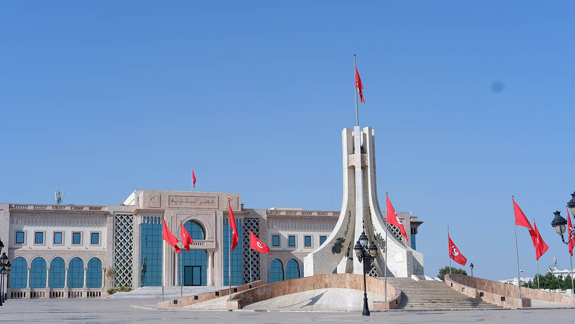 Tunisian red national flags contrasted against the cloudless sky is captivating to the eye.