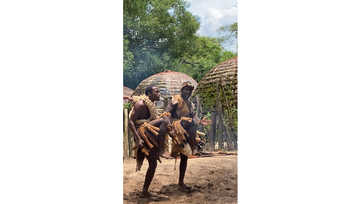 Men dancing wearing traditional dress in Veyane Cultural Village St.Lucia