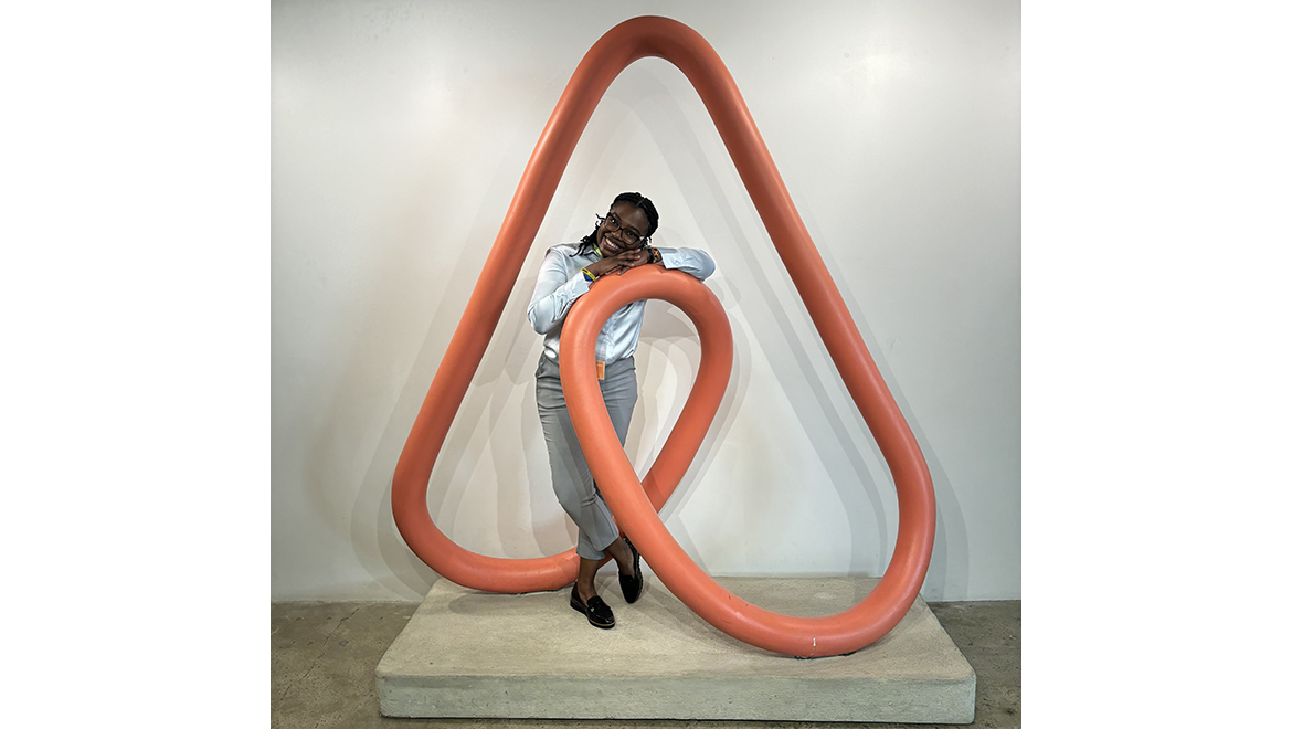 Chelsea Kotey '25 with Airbnb icon during Baker-Simpson Experience