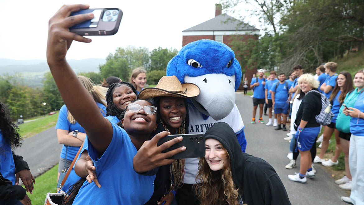 Hartwick College Students during Wick Week with Swoop taking selfie