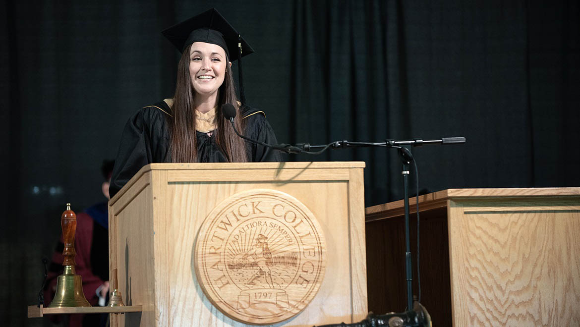 Hartwick College Alumni Association Board of Directors President, Sarah Otto Sanders '11 inducts graduates into the Alumni Association