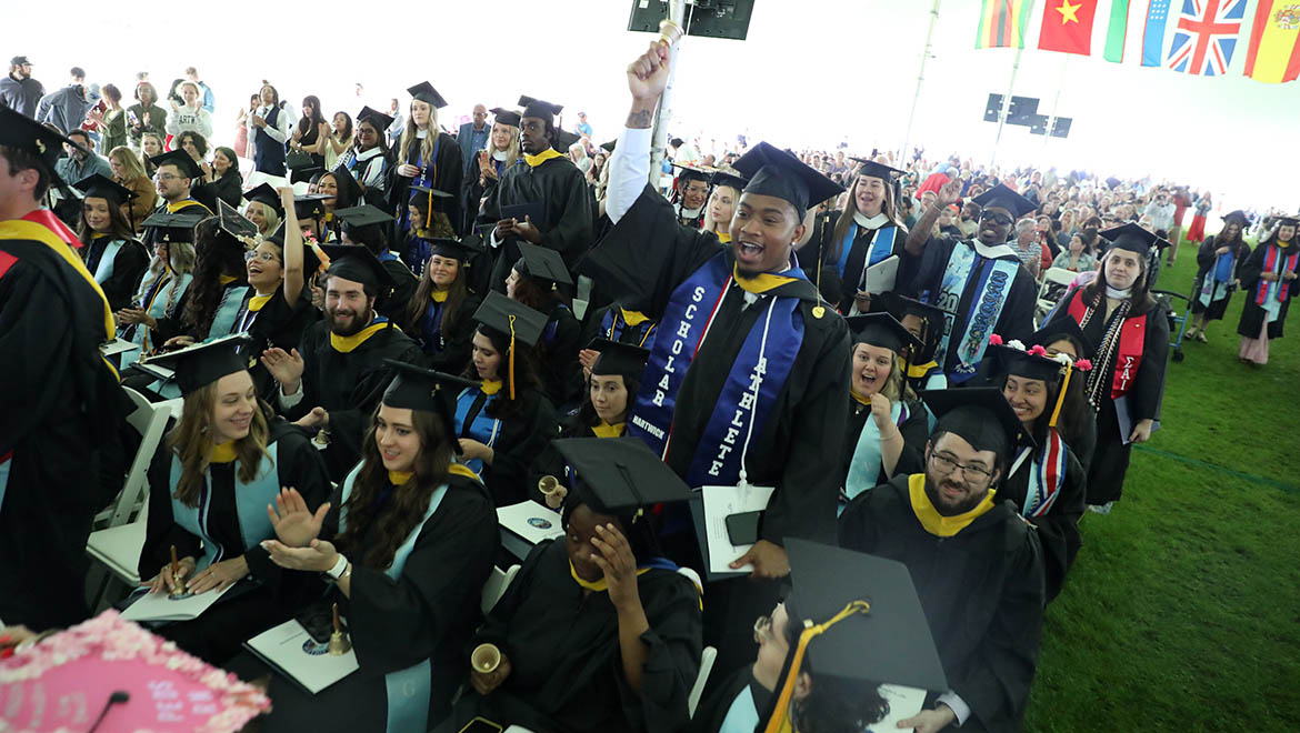 Hartwick College graduates ringing bells