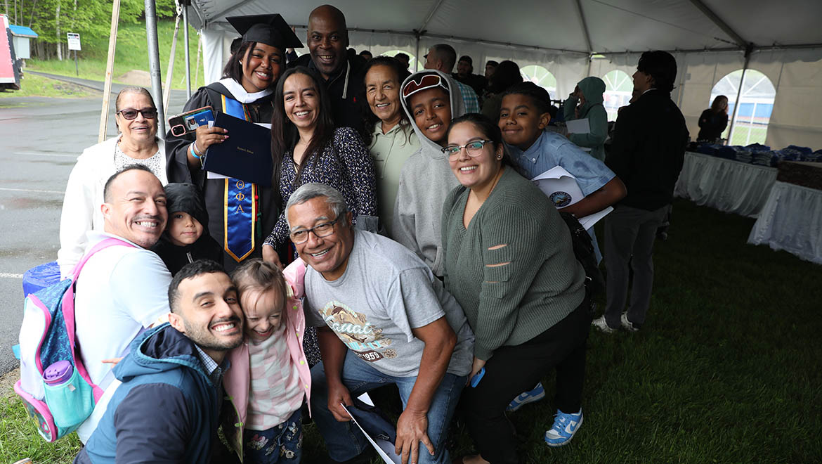 Hartwick College graduate with family