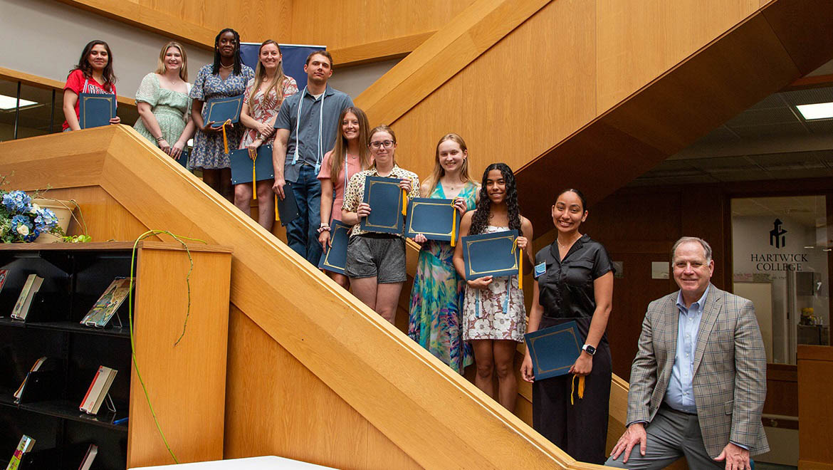 2024 Hartwick College Honor Society Inductees with Interim President Mullen in Library