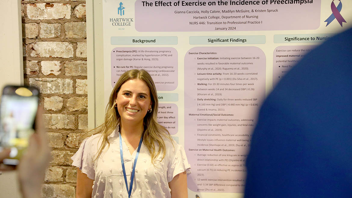 Hartwick College student presenting research poster during Student Showcase