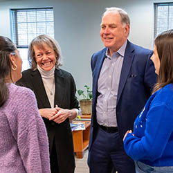 Hartwick College President Jim Mullen and wife Mari talking with students