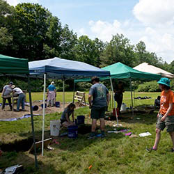 Students at Hartwick College Pine Lake Archaeological Field School dig site