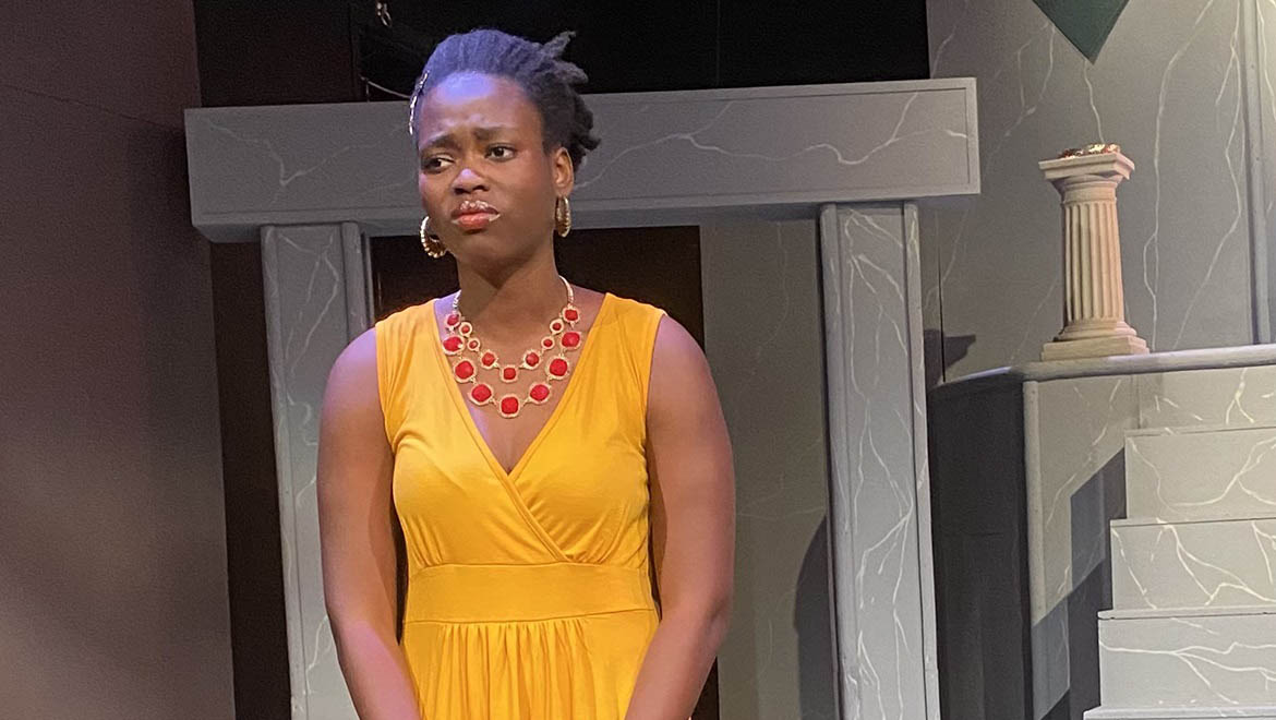 Hartwick student on stage in performance of Antigone
