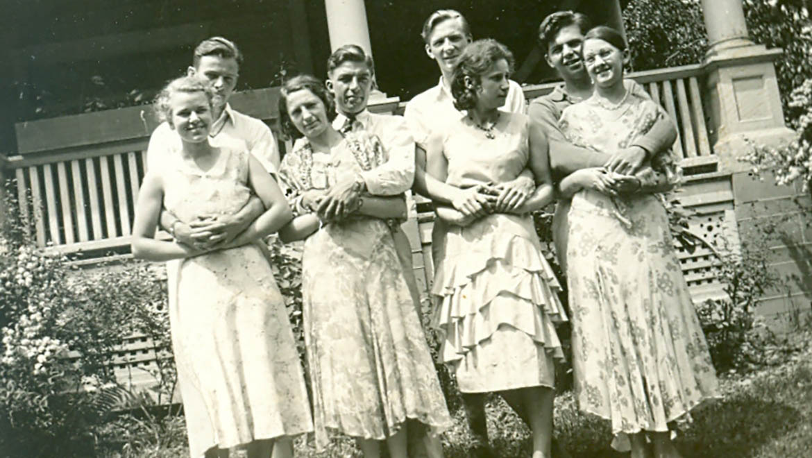 Hartwick College students outside home in city in 1930