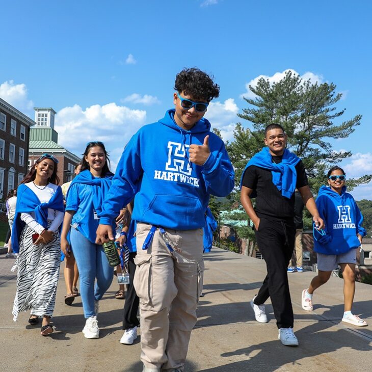 Hartwick College students walking on Founders' Way during First Walk Tradition
